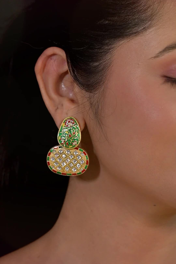Green and gold earring.