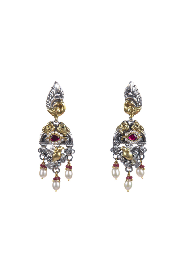 Pair of ornate earrings with pearls and gemstones