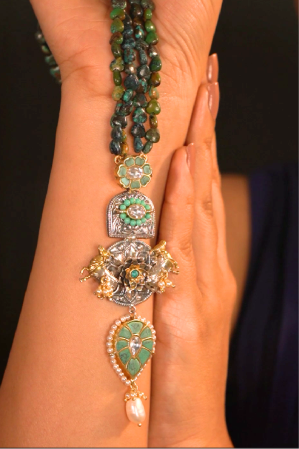 multiple green and gold bracelets