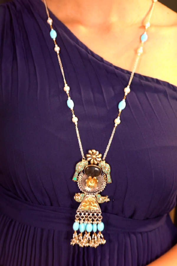 Long beaded necklace with a decorative pendant