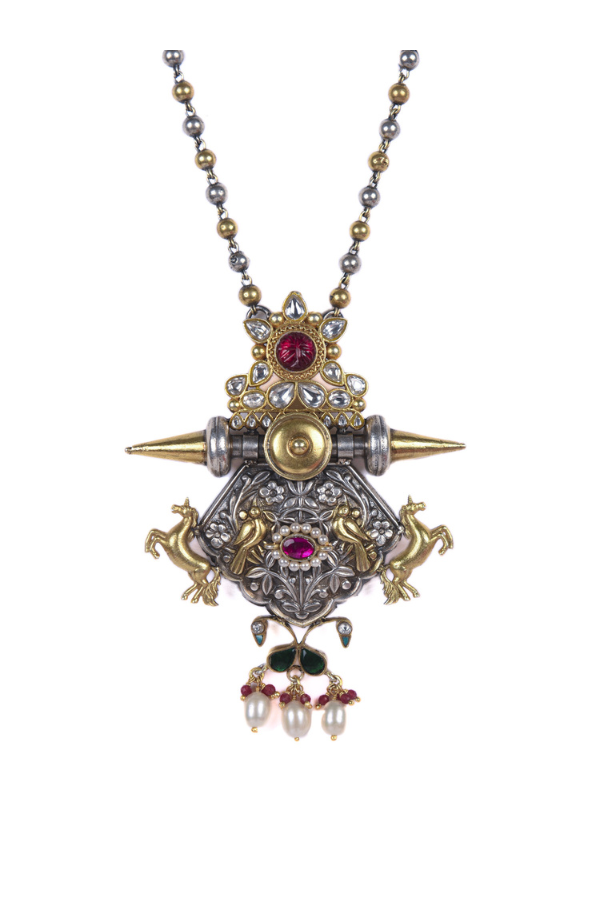Ornate necklace with a central pendant featuring gemstones and pearls