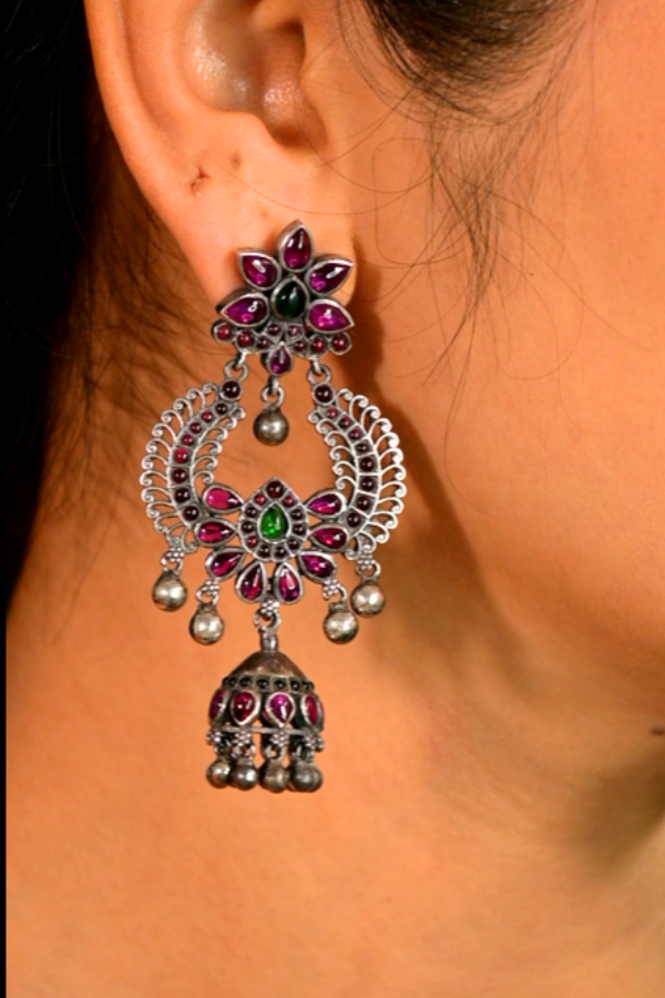 ornate earring with gemstones