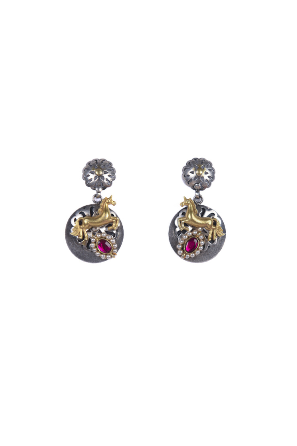 Pair of ornate earrings with gemstones