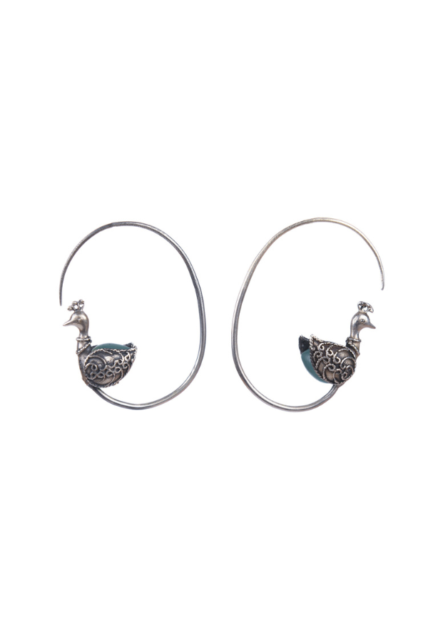 silver earrings with intricate designs