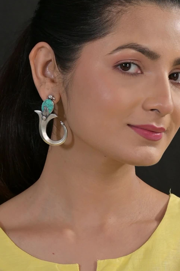 Silver earring with a turquoise stone