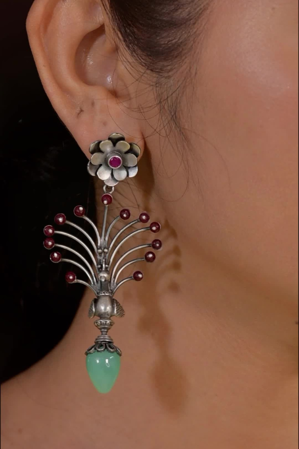 Earring with floral design and gemstones