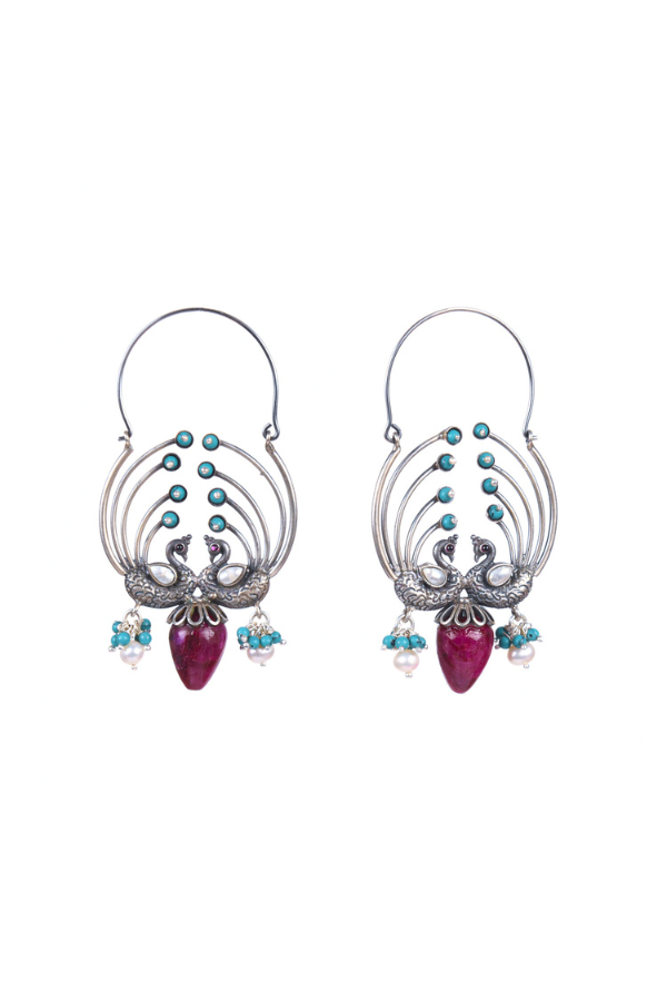 Pair of earrings with intricate design and colorful beads