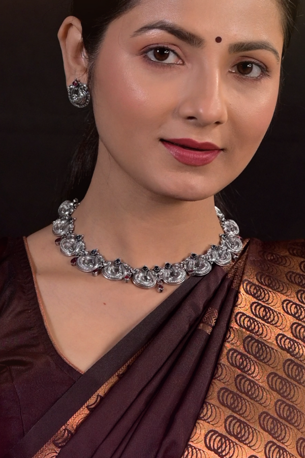 silver necklace and earrings