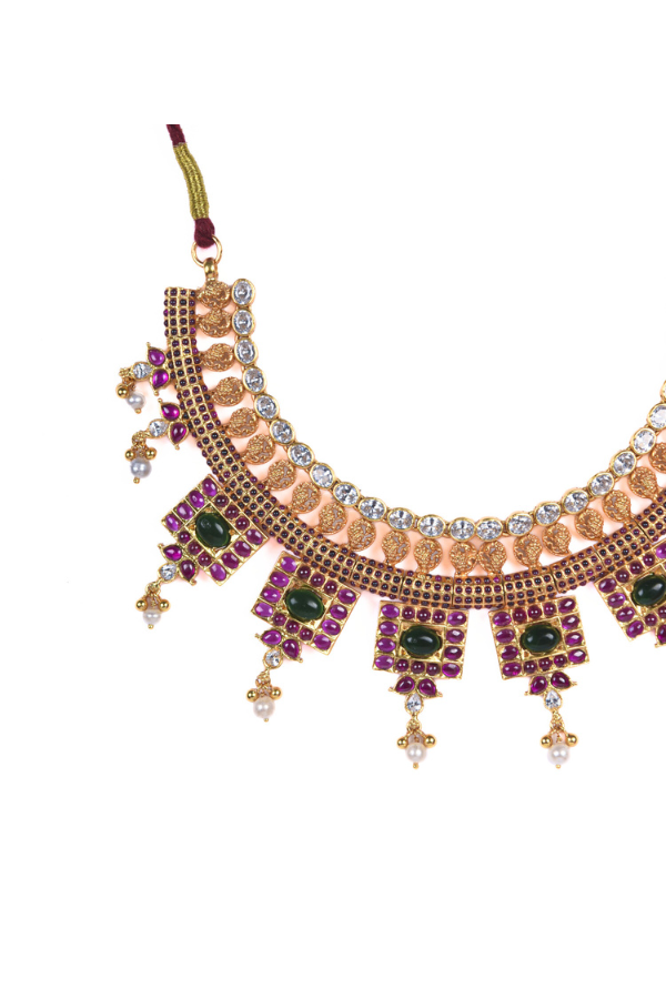 Ornate necklace with green and ruby stones 