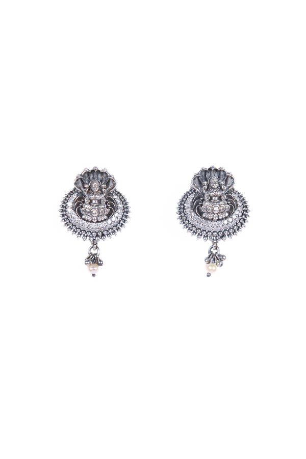 Pair of silver earrings with intricate designs