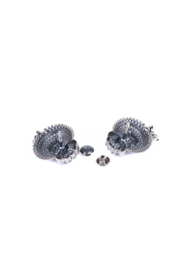 Pair of silver earrings with intricate designs