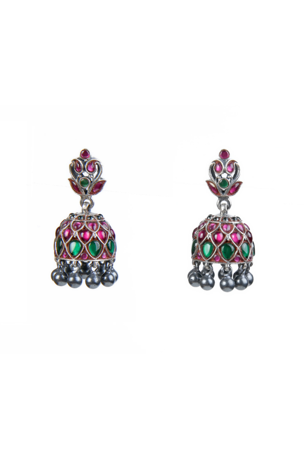 Pair of ornate earrings with gemstones 