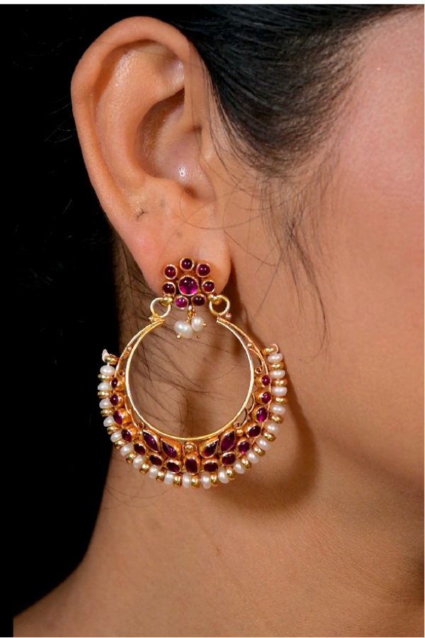 Gold hoop earring with red and white pearl