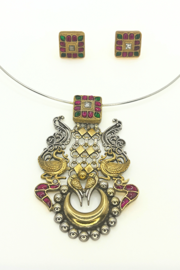 Ornate gold and silver necklace with gemstones