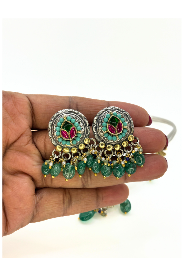Decorative earrings with green gemstones