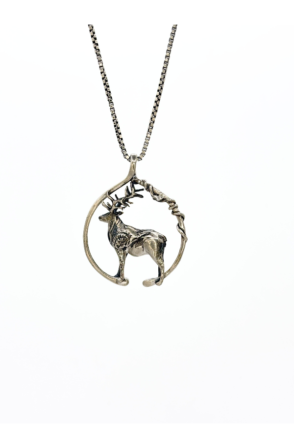 Silver deer pendant necklace on a white background