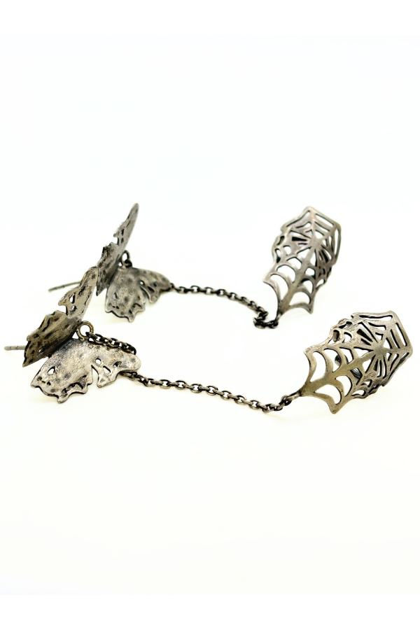 Silver earring with spider web design