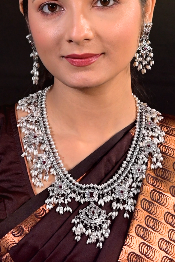 silver necklace and earrings 