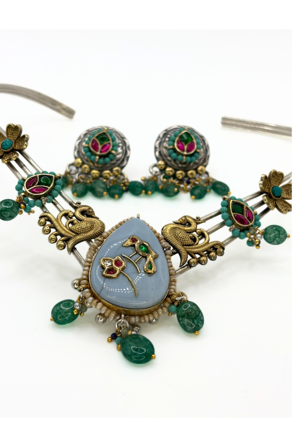 Ornate necklace with green and gold details