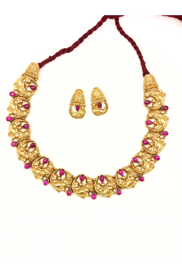 Gold necklace with pink stones and matching earrings