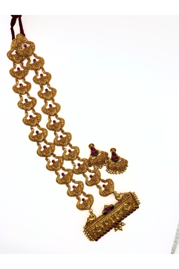 Gold necklace with intricate designs 