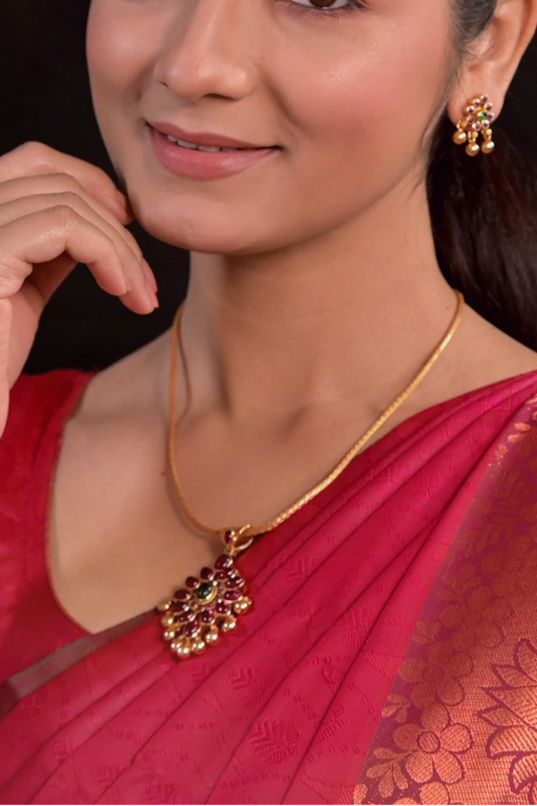 gold plated jewelry including a necklace and earrings.