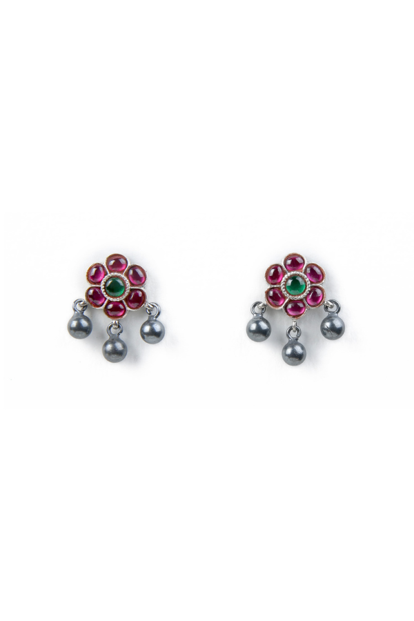 Pair of floral earrings with red petals and green gemstones 