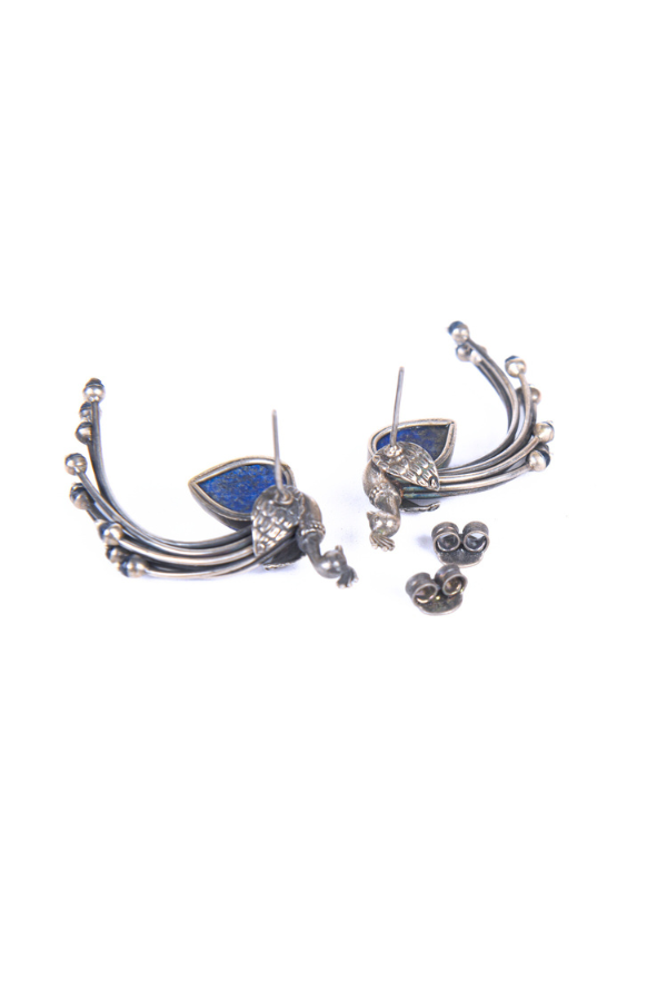 Pair of silver earrings with blue gemstones
