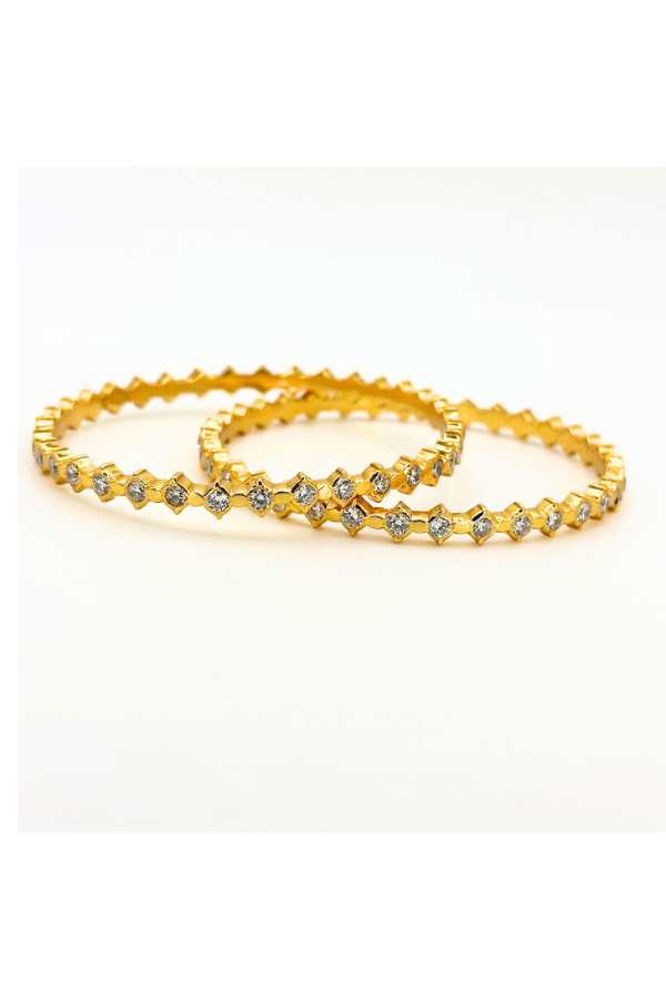 Two gold polished bangles with embedded stones