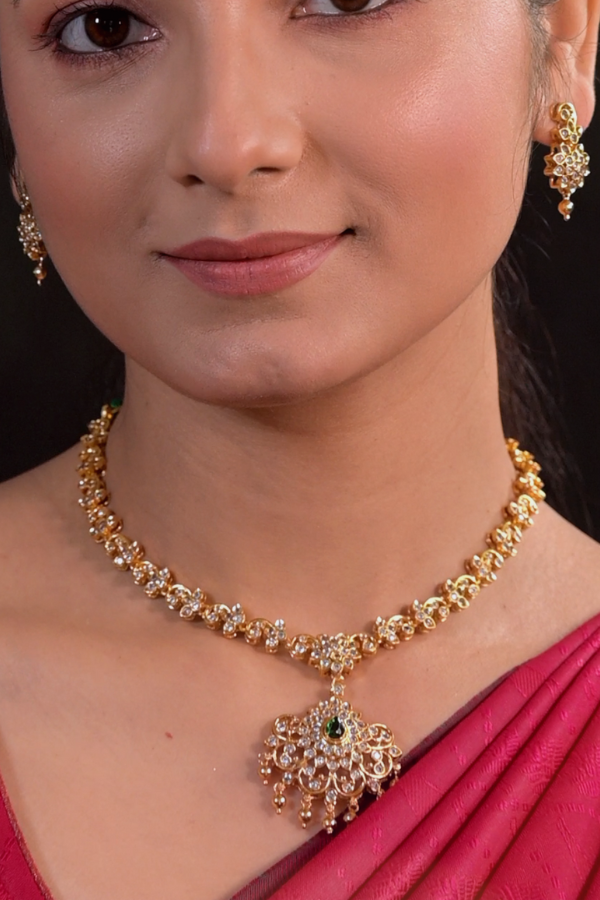 Silver gold plated necklace and earrings with white stones